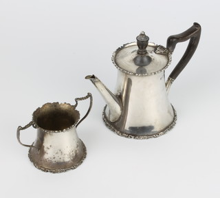 A Bachelor's silver teapot and sugar bowl with fancy rims London 1910, maker Josiah Williams & Co gross weight 338 grams  