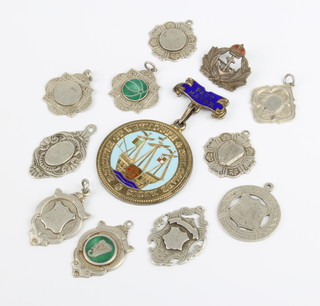 A silver and enamel Past Mayor's jewel, Birmingham 1955, 10 sports fobs, 117 grams 