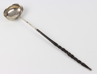 A Georgian silver toddy ladle with whalebone handle 37cm 