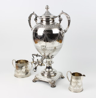 A Victorian silver plated samovar with chased floral fern geometric decoration with twin scroll handles on a square base, raised on claw feet 50cm, together with  a matching cream jug and sugar bowl all engraved December 25 1878 