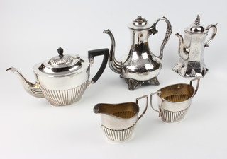 A Victorian silver plated chased coffee pot, a 3 piece plated tea set and a plated coffee pot 