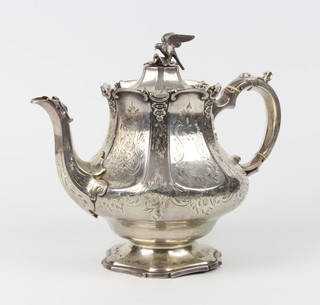 A Victorian silver teapot with chased scrolls, floral decoration and bird finial with S scroll handle London 1849, maker Edward, John and William Barnard, 748 grams 