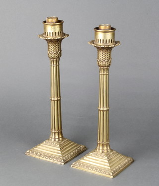 A pair of Victorian ex-plated candlesticks on stepped bases 31cm 