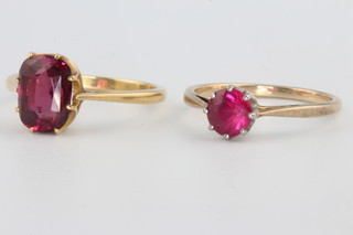 An 18ct yellow gold garnet ring size M, a 9ct do. size L