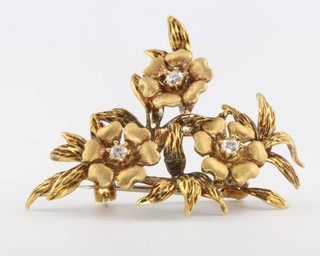 An 18ct yellow brushed gold diamond set floral brooch 42mm x 35mm 
