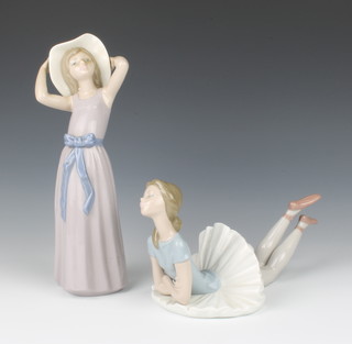 A Lladro figure of a ballerina lying down 24cm, do. of a lady wearing a sun hat 26cm 