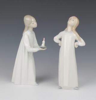 A Lladro figure of a girl in her nightdress 20cm, do. holding a chamber stick 20cm 