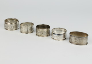 A silver engine turned napkin ring Birmingham 194 and 4 others 74 grams 