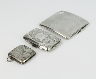 A silver engine turned cigarette case Birmingham 1927, a do. vesta and cigarette case 180 grams 