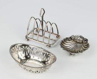 A silver 5 bar arched toast rack London 1934, a shell dish, an oval dish 78 grams 