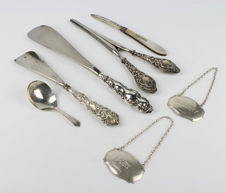 A silver mother of pearl fruit knife Sheffield 1910, 3 mounted items, 2 labels and a caddy spoon 