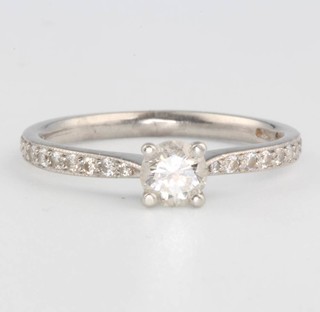 A platinum single stone diamond ring with diamond shoulders, size J approx. 0.35ct 