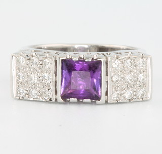 An 18ct white gold amethyst and diamond ring set with 1 square cut amethyst approx. 0.9ct flanked by 9 brilliant cut diamonds to each side approx. 0.27ct, size M, with certificate 