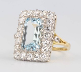 An 18ct yellow gold rectangular aquamarine and diamond ring the centre stone approx. 4ct the diamonds approx. 1.5ct size O 1/2