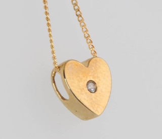 A 9ct yellow gold heart shaped pendant and chain 1.4 grams 