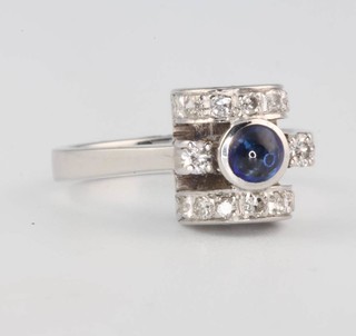A white gold Art Deco style sapphire and diamond ring set with a cabochon cut sapphire and brilliant cut diamonds size L  