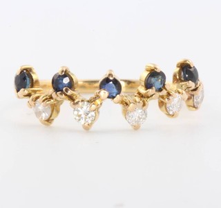 An 18ct yellow gold sapphire and diamond ring size O 