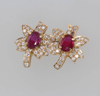 A pair of yellow gold ruby and diamond floral ear studs 