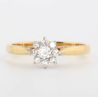 An 18ct yellow gold diamond daisy ring size O 1/2