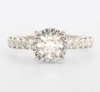 An 18ct white gold single stone illusion set diamond ring approx. 1ct with brilliant cut diamond shoulders approx. 0.53ct size N, together with an EDR certificate 
