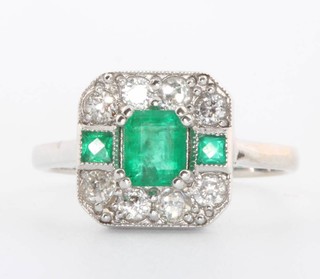 An 18ct white gold Art Deco style emerald and diamond ring size N 
