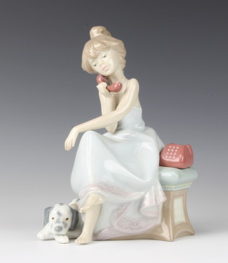 A Lladro figure of a young lady using a telephone with a Dalmatian at her feet 5466 21cm 