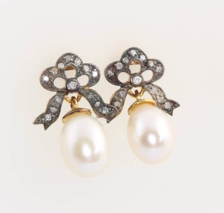 A pair of Victorian style gold pearl and diamond drop earrings 