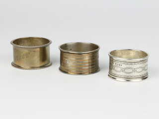 A silver napkin ring Birmingham 1945 and 2 others, 60 grams 