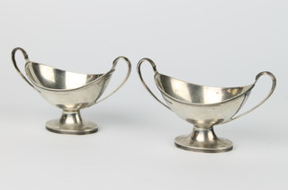 A pair of Edwardian silver boat shaped table salts Sheffield 1908 121 grams