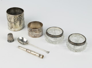 An Edwardian repousse silver bottle sleeve, 2 salts and 4 other items 