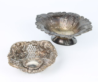 A Victorian style repousse silver dish with scroll decoration London 1974 15cm, a pierced do. 11cm, 151 grams