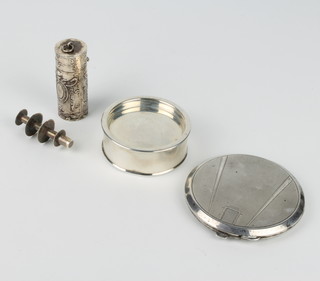 A circular silver patch box London 1942, a compact and a cotton holder 
