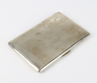 A silver engine turned cigarette case London 1945 183 grams