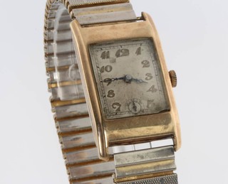 A gentleman's Art Deco 9ct yellow gold wristwatch in a tonneau case with seconds at 6 o'clock 