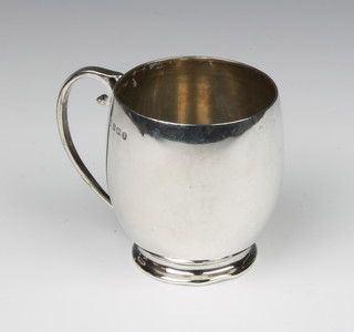 A bulbous silver mug with simple handle Birmingham 1937 125 grams 