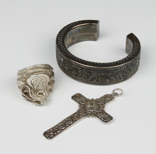 A silver bangle, cross pendant and ring, 117 grams