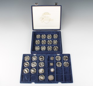 Four silver Britannia 1oz coins 1999, 2004, 2005 and 2007, a quantity of silver commemorative crowns, 436 grams 