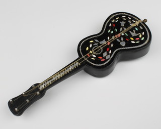 A mother of pearl and papier mache musical guitar 24cm 