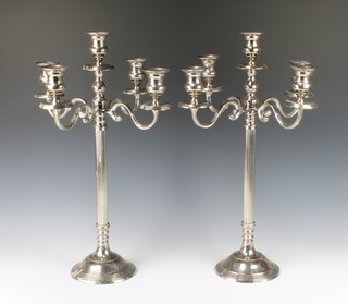 A pair of 5 light candelabra on reeded stems 52cm 