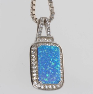 A silver cubic zirconia and opalite set pendant and chain 