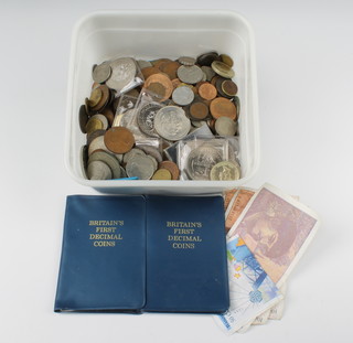 A collection of minor UK coins including a first decimal coin set, commemorative crowns etc 