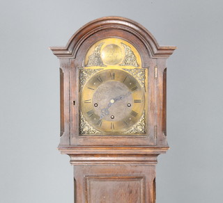 A 1930's 8 day chiming longcase clock with 21cm arched brass dial, gilt spandrels, Roman numerals, striking on gongs, contained in an oak case  with sliding hood 167cm h 