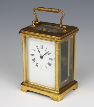 A 19th/20th Century 8 day carriage clock with enamelled dial and Roman numerals contained in a gilt metal case  11cm h x 8cm w x 6.5cm d 