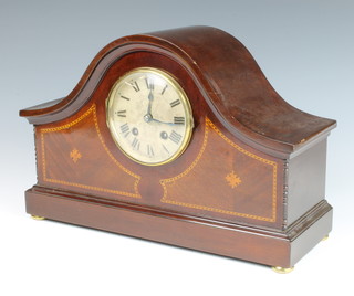 Hamburg American Clock Co., an Edwardian 8 day striking mantel clock with silvered dial and Roman numerals contained in an arch shaped inlaid mahogany case 