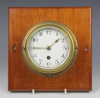 A wardroom style clock with enamelled dial and Arabic numerals contained in a brass case with gilt dial 12cm 