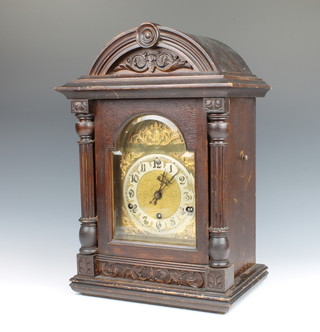 A Continental chiming bracket clock with 18cm gilt dial, silvered chapter ring contained in a walnut case, striking on a gong, the back plated marked 33133 