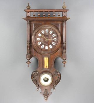 A 19th Century Continental striking wall clock fitted a barometer and thermometer contained in a carved walnut case 91cm h x 36cm w x 16cm d 