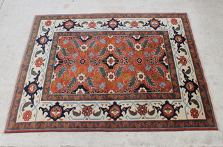 A brown and green ground Turkish carpet with floral field 267cm x 204cm 