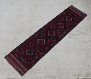 A red and blue ground Meshwani runner with 5 octagons to the centre 