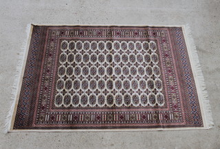 A beige ground Bokhara style Belgian cotton rug 190cm x 140cm 
